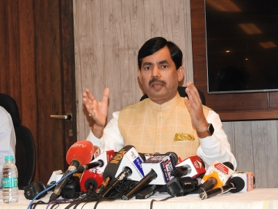 Shahnawaz Hussain Questions Banerjee's Leadership Role in INDIA Bloc.webp