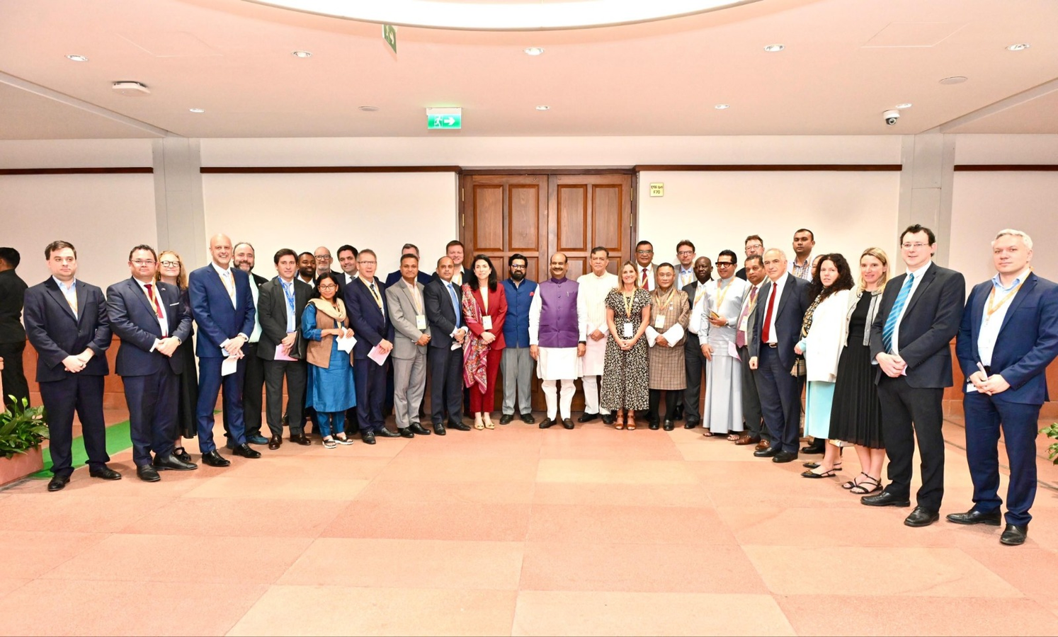 Birla Hosts International Delegation at Parliament.webp