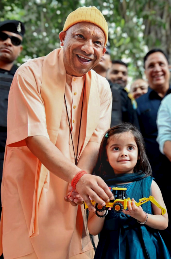 4-Year-Old Gifts Toy Bulldozer to CM Adityanath.webp
