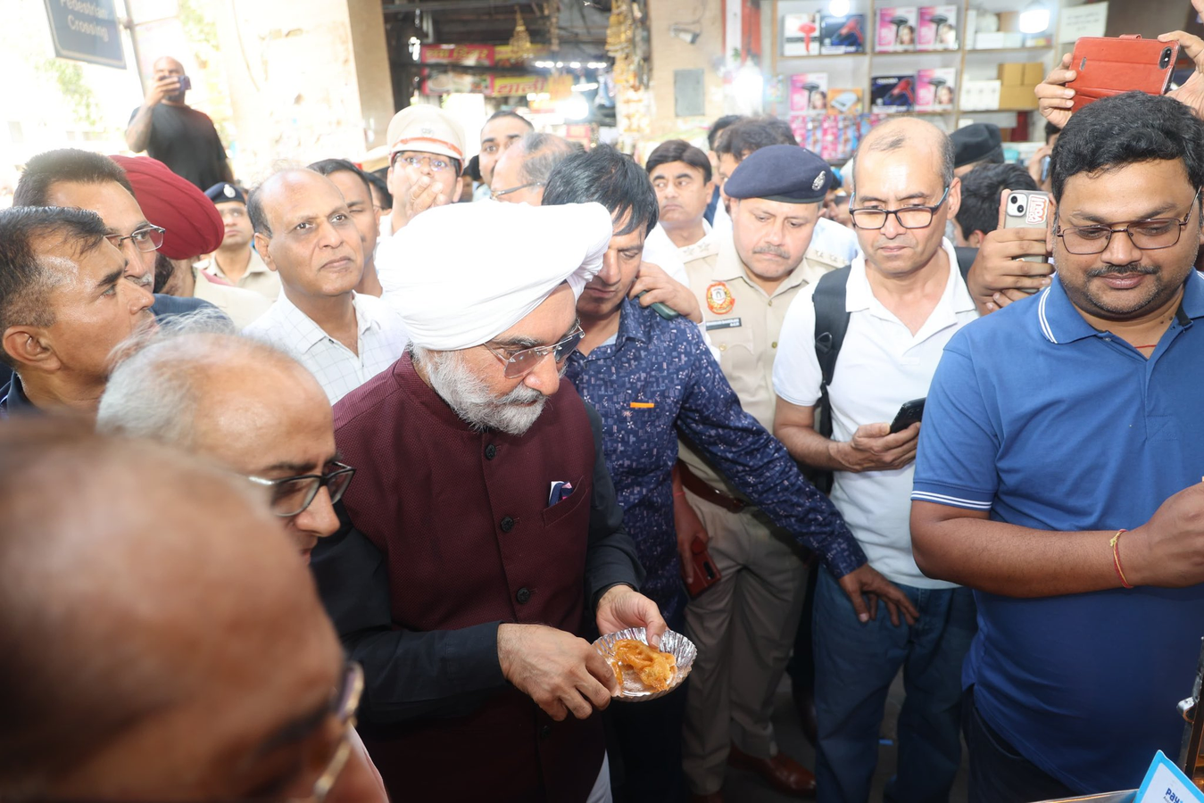 Sandhu's Informal Outreach: L-G Samples Sweets in Old Delhi.webp